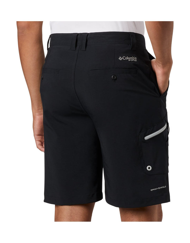 Close up of man wearing Columbia Men's PFG Terminal Tackle™ Short - black, back view with hand in right pocket