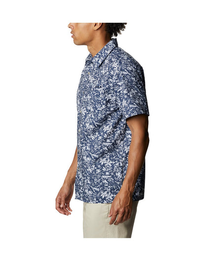 Man wearing Columbia Men's PFG Super Slack Tide™ Camp Shirt - collegiate navy kona print, side view