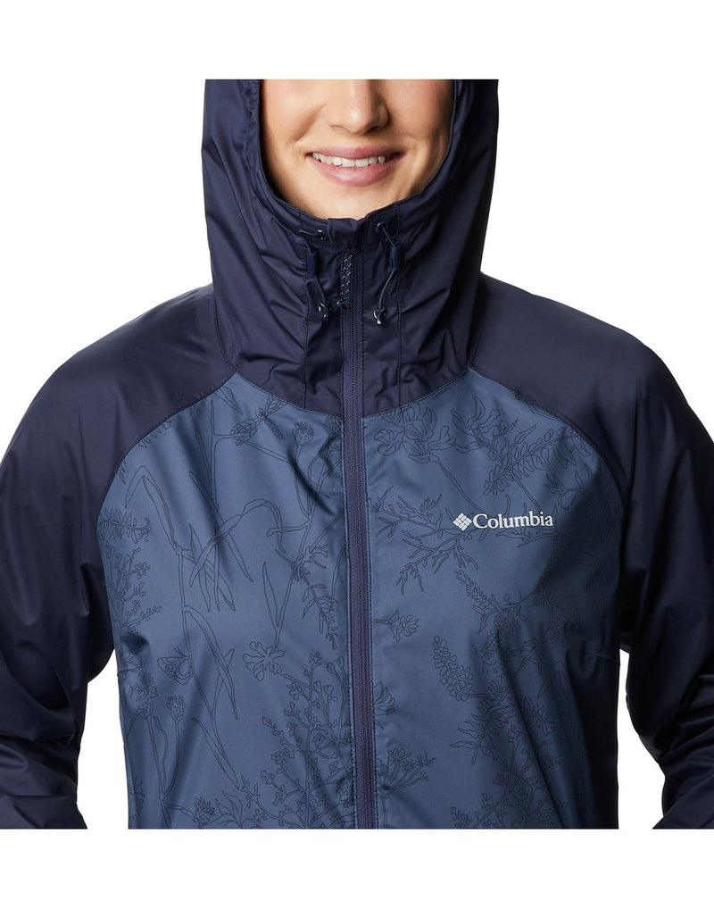 Model wearing Columbia Women's Ulica™ Jacket - nocturnal blue, close up of front with hood up