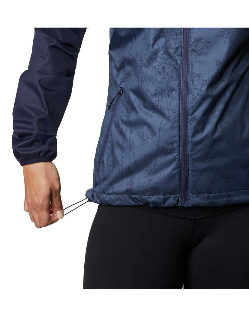 Model wearing Columbia Women's Ulica™ Jacket - nocturnal blue, close up of drawcord adjustable hem