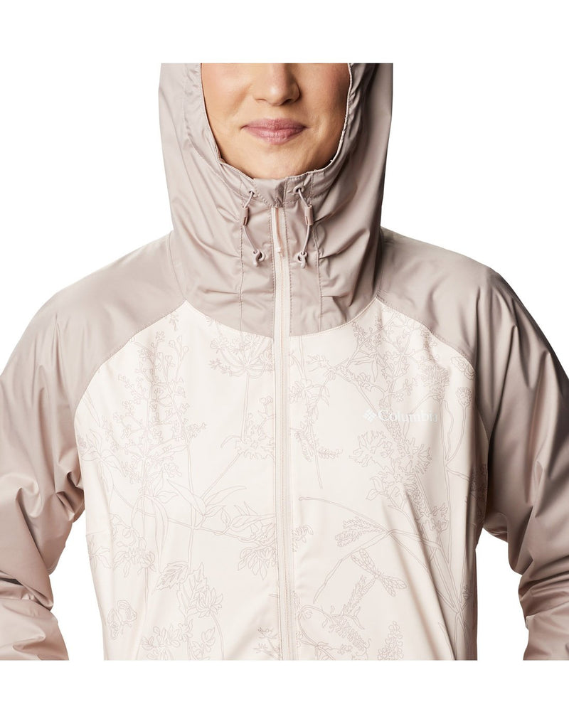 Model wearing Columbia Women's Ulica™ Jacket - peach quartz, close up of front with hood up