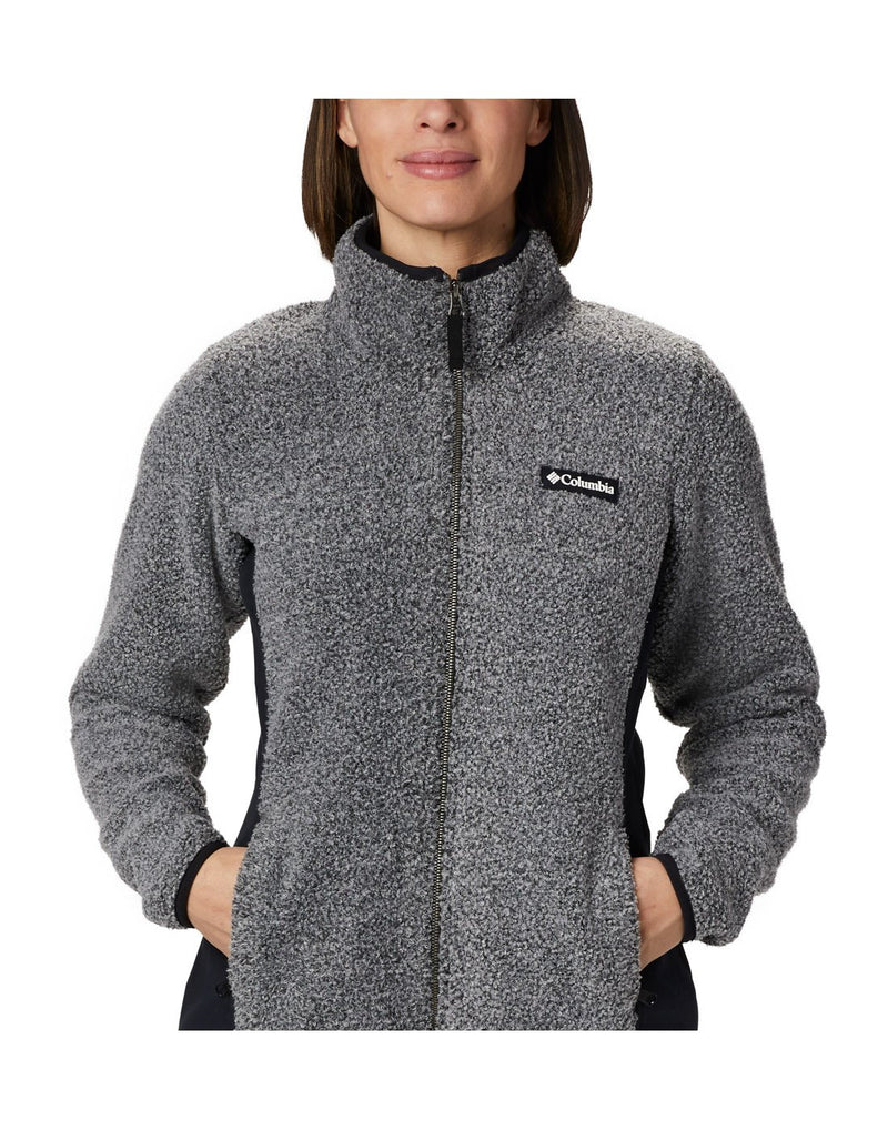 Close up of woman wearing Columbia Women's Panorama™ Full Zip Jacket in charcoal heather, zipped up, front view, hands in pockets with Columbia logo on left chest