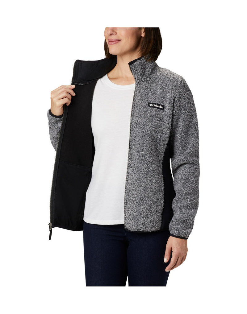 Woman wearing Columbia Women's Panorama™ Full Zip Jacket in charcoal heather, unzipped, holding one side open to show black interior