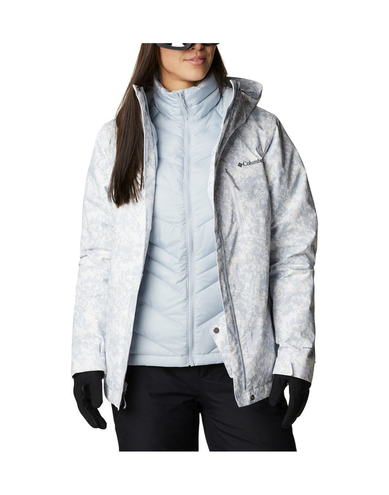 Woman wearing Columbia Women's Whirlibird™ IV Interchange Jacket in white florescence, front view, with top shell unzipped