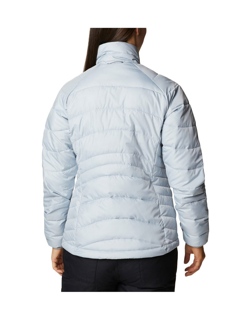 Woman wearing Columbia Women's Whirlibird™ IV Interchange Jacket, shell removed, lighter puff jacket, back view