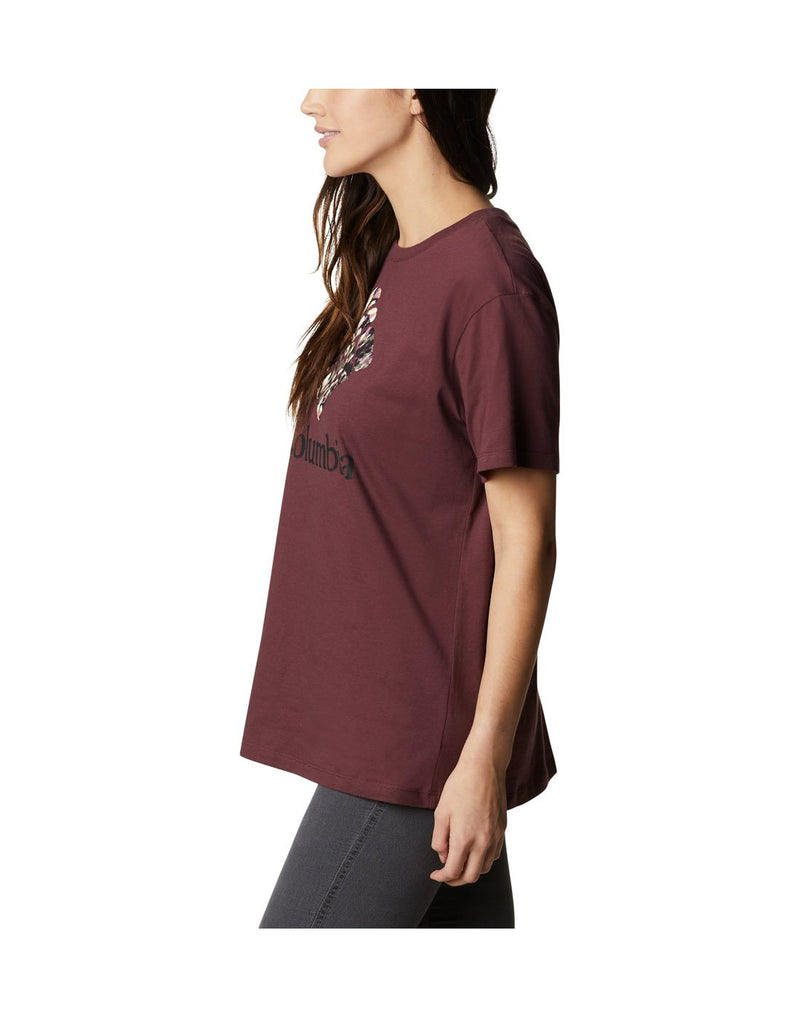Woman wearing Columbia Women's Columbia Park™ Relaxed Tee in malbec colour, side view