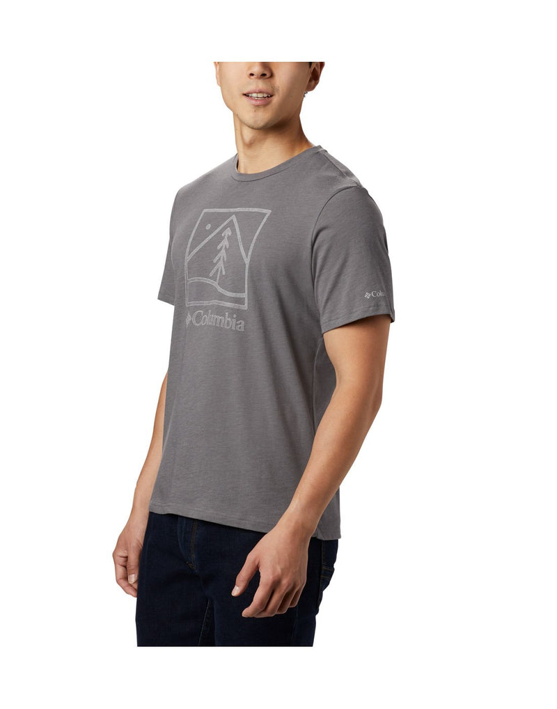 Man wearing Columbia Men's Bluff Mesa™ Graphic T-Shirt - city grey, front side view