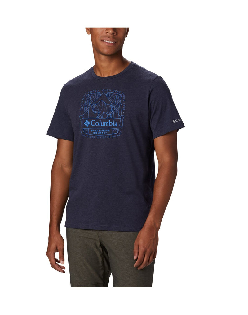 Man wearing Columbia Men's Bluff Mesa™ Graphic T-Shirt in collegiate navy