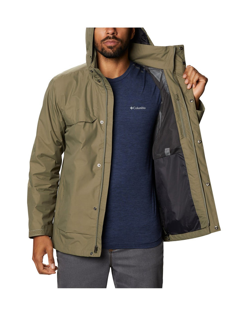 Model wearing Columbia Men's Tryon Trail™ Shell - stone green, front view, unzipped and holding half open to show interior