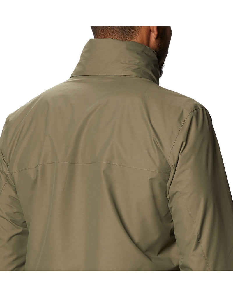 Model wearing Columbia Men's Tryon Trail™ Shell - stone green, close up of back with hood stowed away