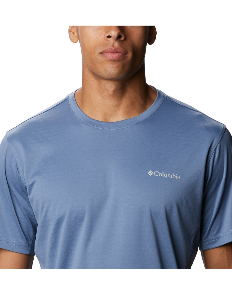 Close up of model wearing Columbia Men's Zero Ice Cirro-Cool™ Short Sleeve Shirt - bluestone with Columbia logo over left breast