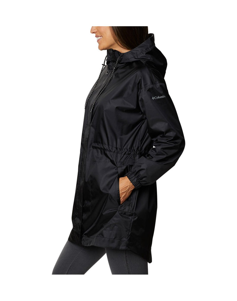 Model wearing Columbia Women's Splash Side™ Jacket - black, side view with hands in pockets