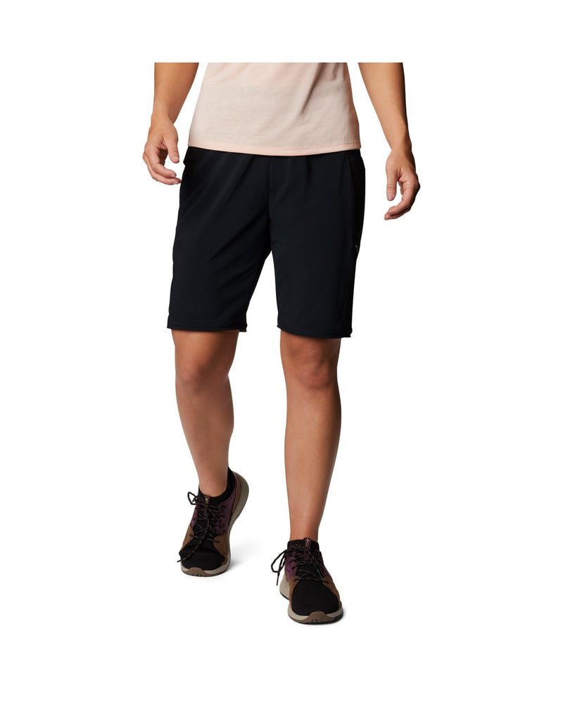 Model wearing Columbia Women's Pleasant Creek™ Convertible Pants - black, showing converted into shorts