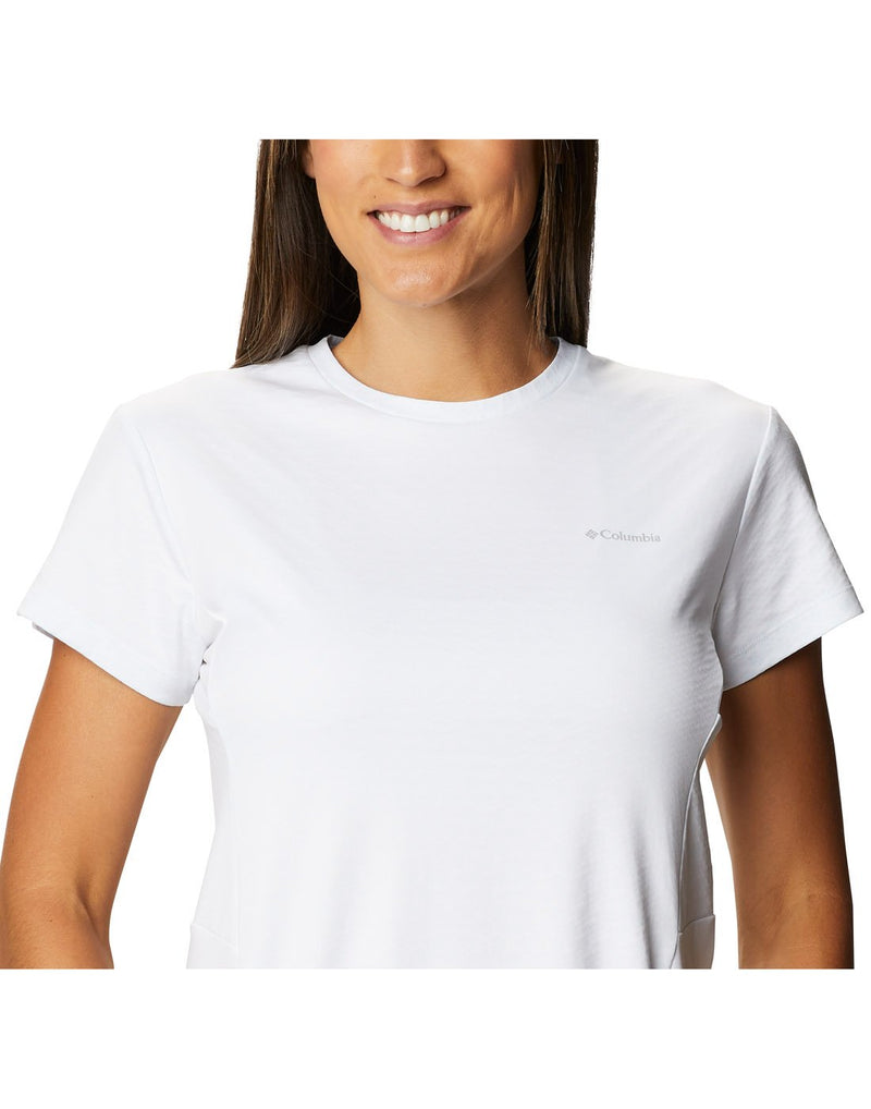 Close up of Woman wearing Columbia Women's Zero Ice Cirro-Cool™ Short Sleeve Shirt - white, front view with Columbia logo on left breast