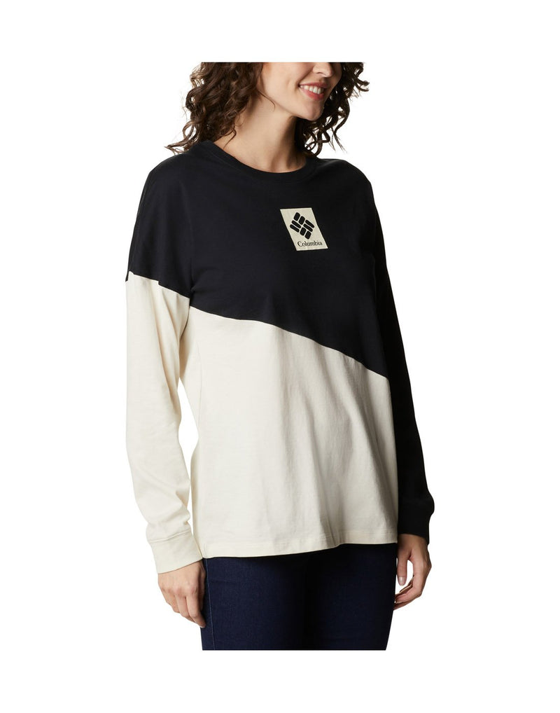 Woman wearing Columbia Women's Columbia Park™ Long Sleeve Tee in chalk/black, front angled view