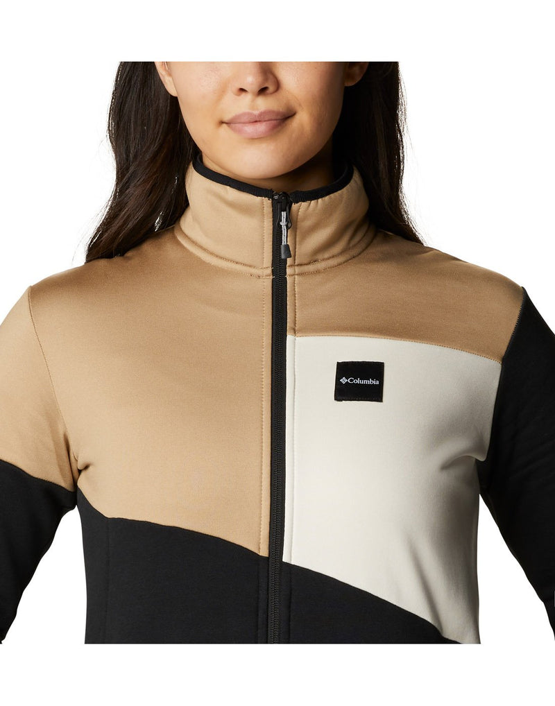Close up of woman wearing Columbia Women's Columbia Lodge™ Hybrid Full Zip Jacket, zipped up, front view with Columbia logo on left chest