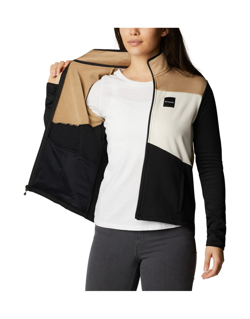 Woman wearing Columbia Women's Columbia Lodge™ Hybrid Full Zip Jacket, unzipped, holding one side open to show interior of jacket