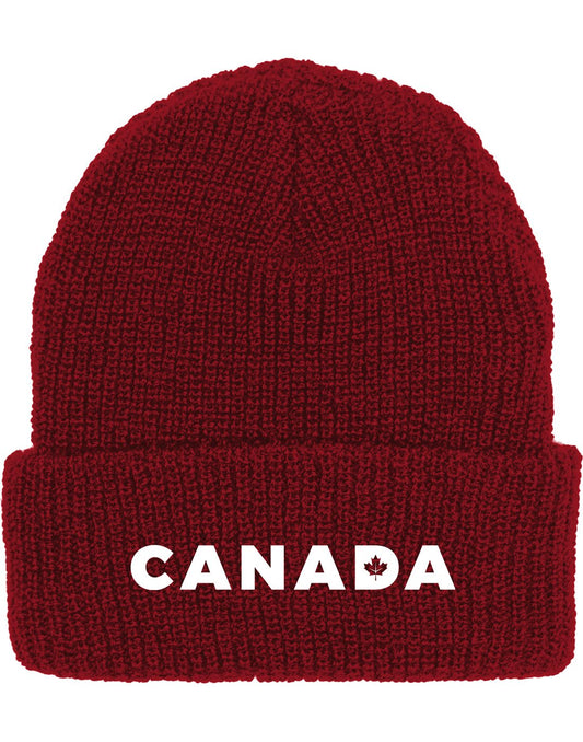 Product Image – Burgundy knit beanie hat with cuff and embroidered word Canada in white with maple leaf cut out in the letter D