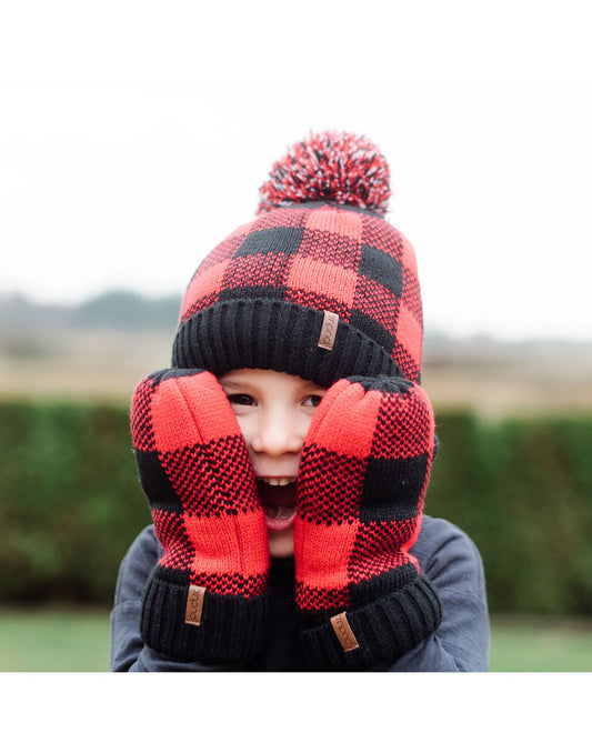 Product Image – Child wearing Pudus Kids Toque Winter Hat and Mittens in Lumberjack Red holding hands up to face