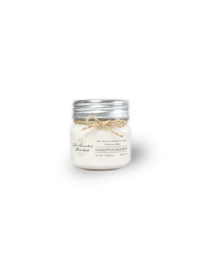 The Scented Market Eucalyptus Lavender 8oz Soy Wax Candle front view in a glass jar with metal lid and tied with a twine bow