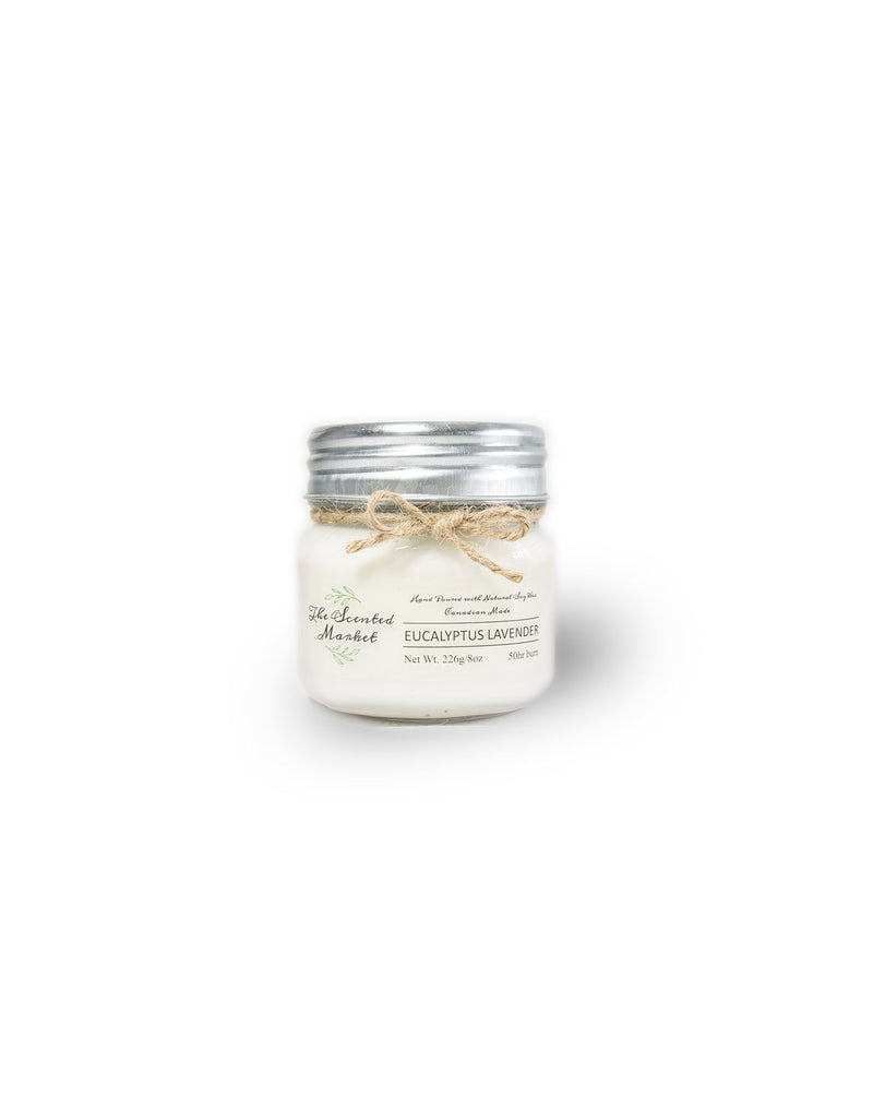 The Scented Market Eucalyptus Lavender 8oz Soy Wax Candle front view in a glass jar with metal lid and tied with a twine bow