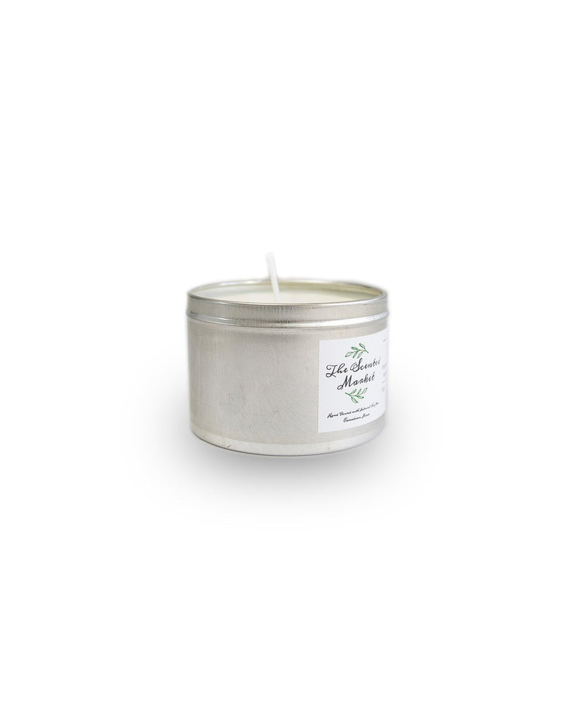 The Scented Market Exhale 4oz Essential Oil Candle in a silver tin with lid off showing wick sticking out