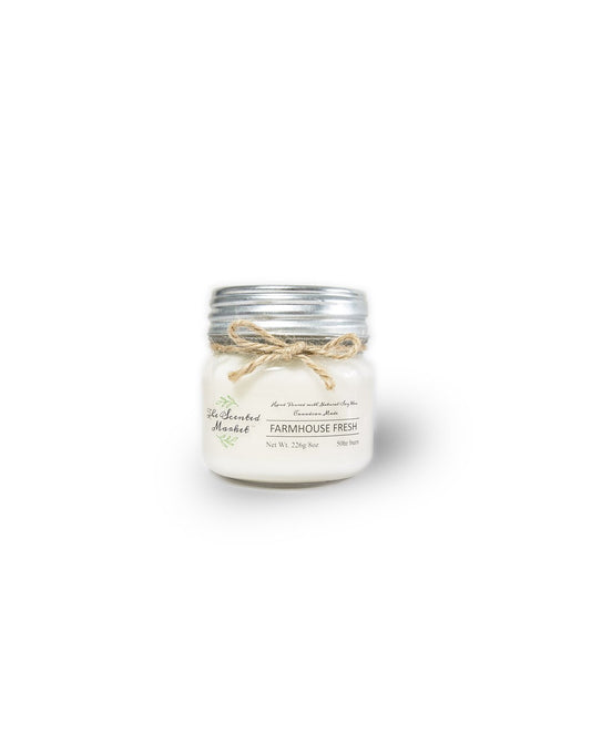 Product Image – The Scented Market Farmhouse Fresh 8oz Soy Wax Candle front view in a glass jar with metal lid and tied with a twine bow