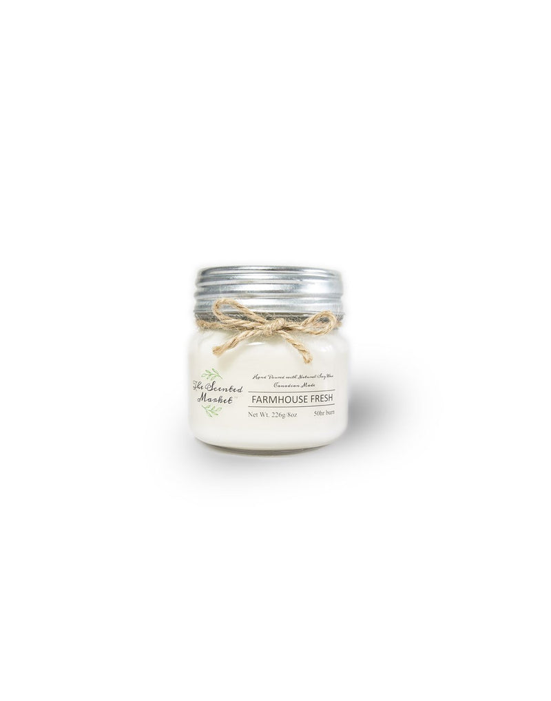 The Scented Market Farmhouse Fresh 8oz Soy Wax Candle front view in a glass jar with metal lid and tied with a twine bow