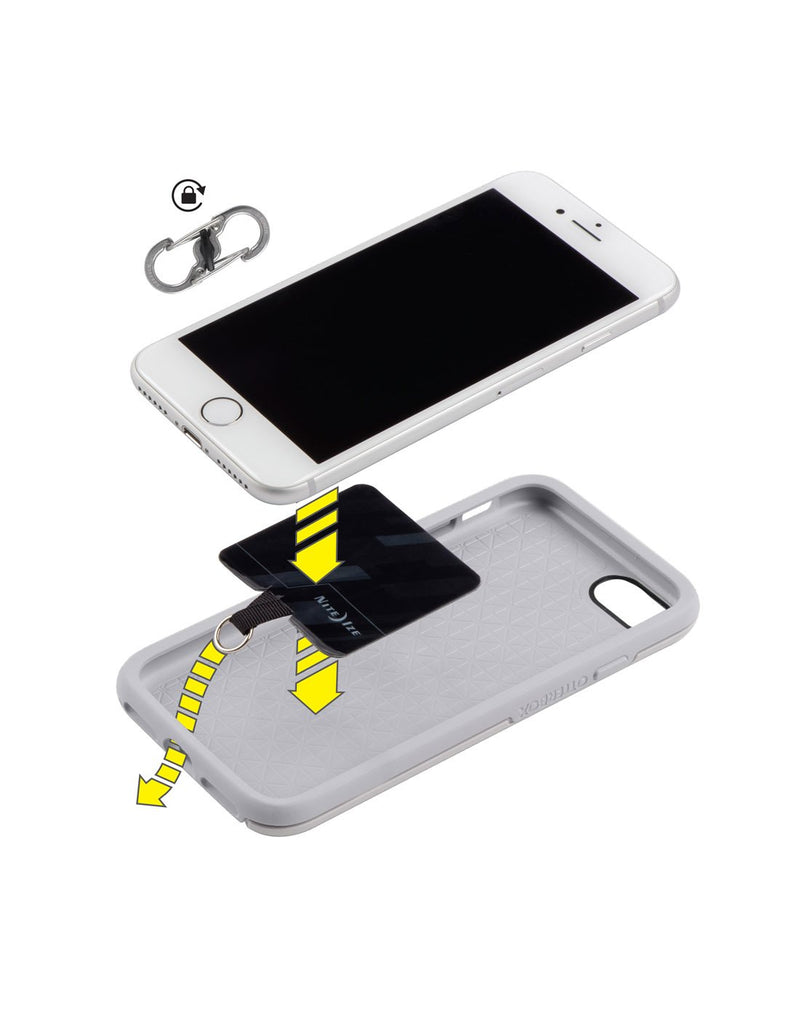 Diagram showing how Nite Ize Hitch® Phone Anchor + Tether attaches between cell phone and case and tether slips through charging port in case