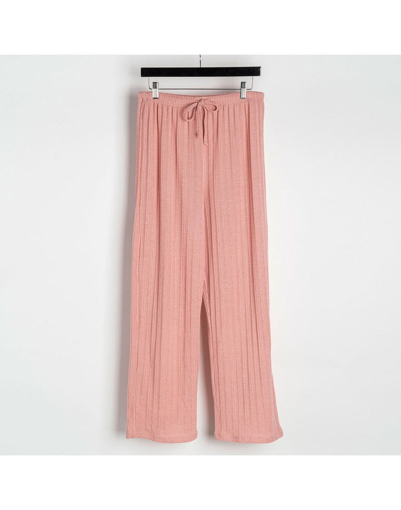 Howard's ribbed pants in blush pink clipped on a hanger