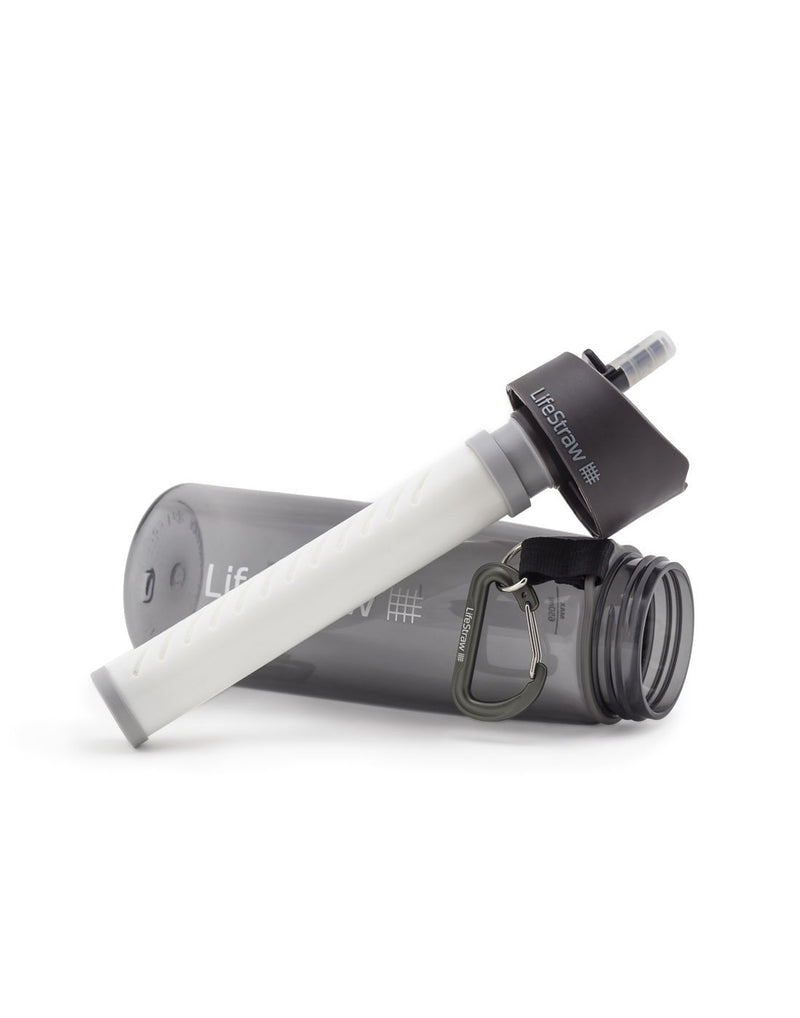 Grey LifeStraw Go Water Filter Bottle on its side with cap off showing filter straw attached to lid