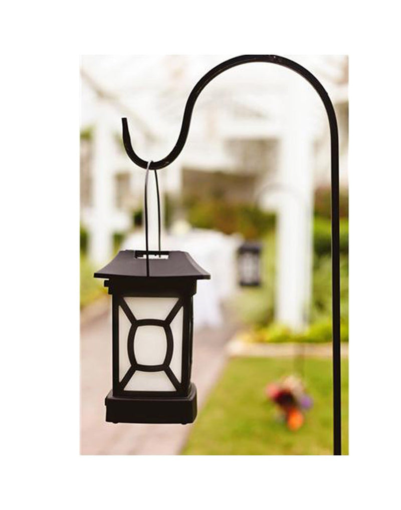 Thermacell MR-9W Patio Lantern Mosquito Repeller hanging on a post in a backyard