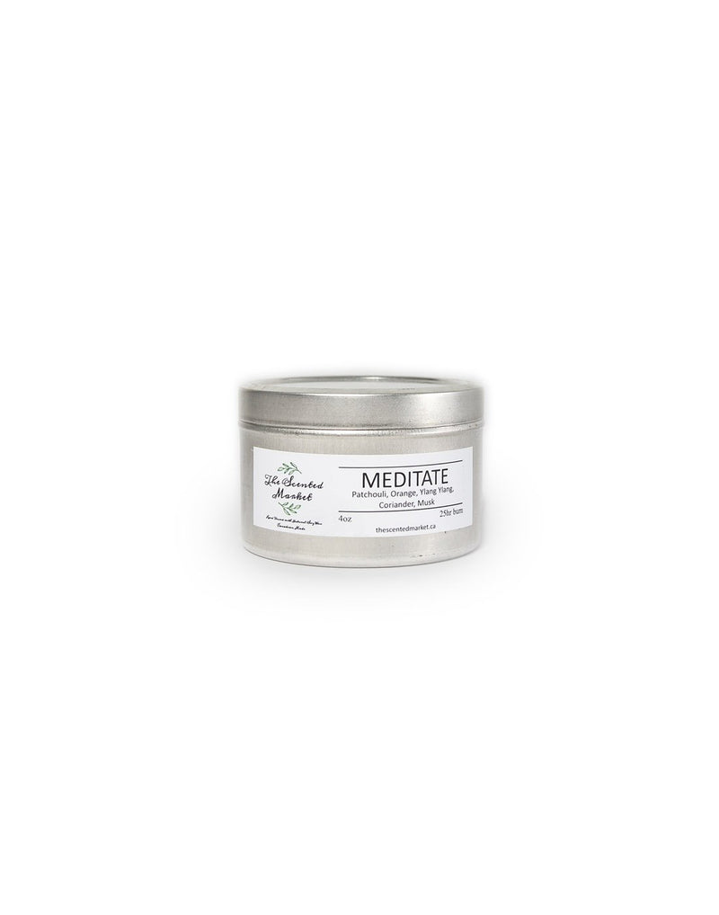 The Scented Market Meditate 4oz Essential Oil Candle in a silver tin with lid on, front view