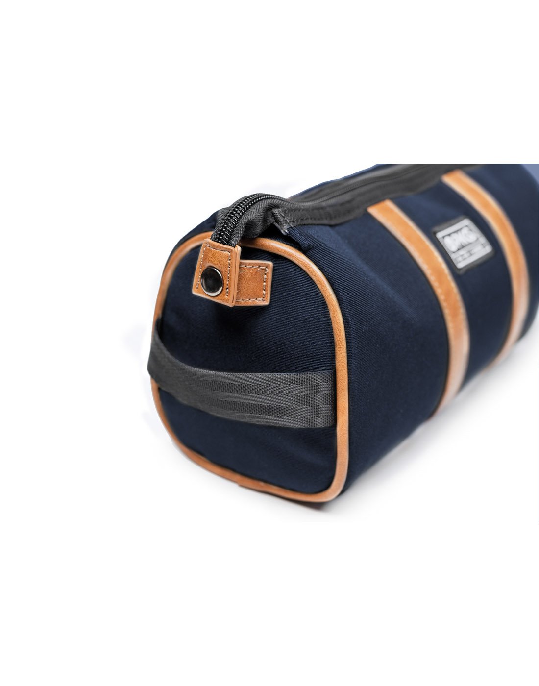 Close up of navy PKG Charlotte Dopp Kit, side view