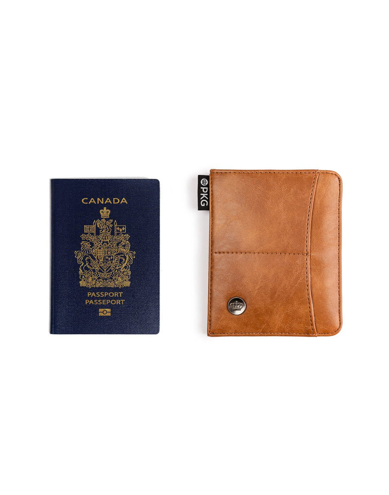 PKG Perry Passport Wallet - tan, front view with Canadian passport beside to show size