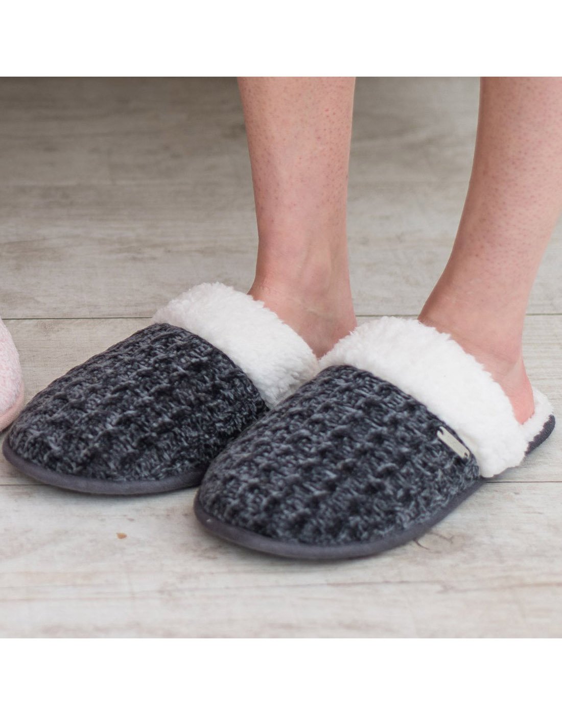 Close up of someone wearing grey Pudus Creekside Chenille Knit Slide Slippers