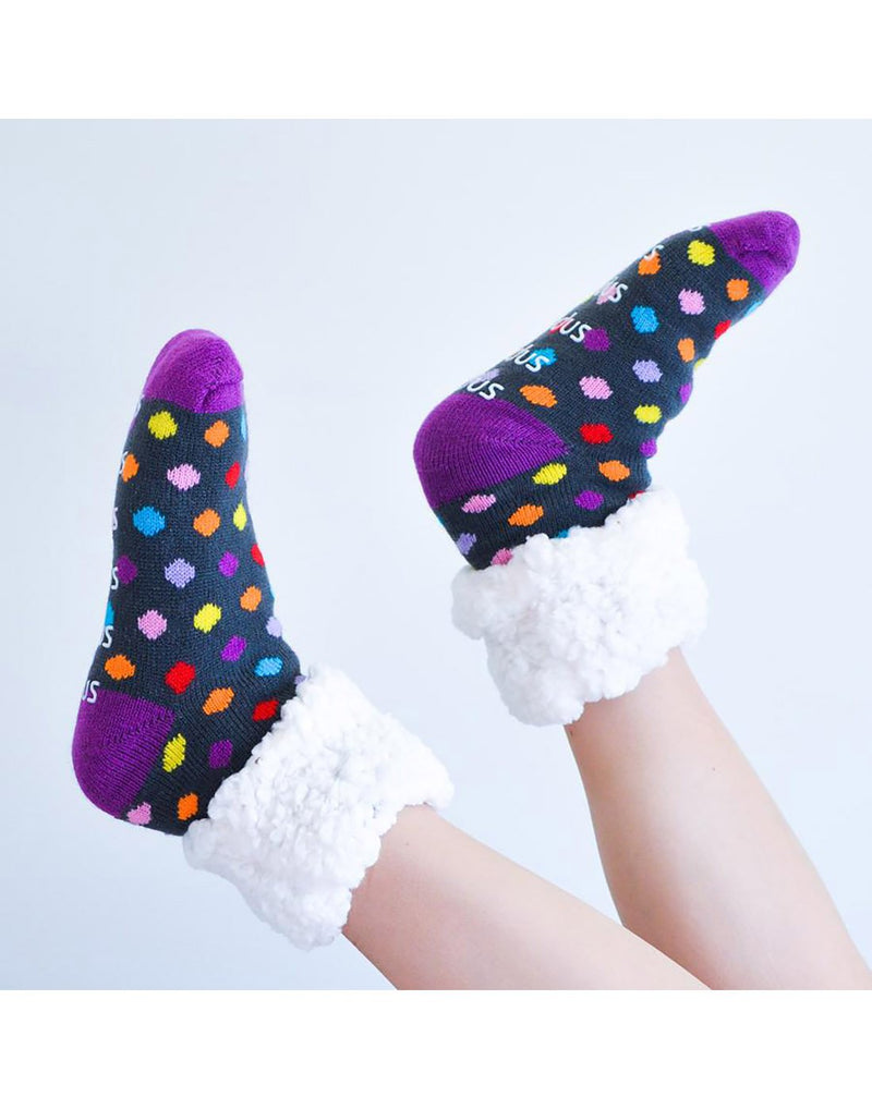 Wearing pudus classic polka dot multi colour slipper socks side view
