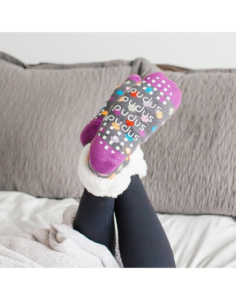 Wearing pudus classic polka dot multi colour slipper socks back view