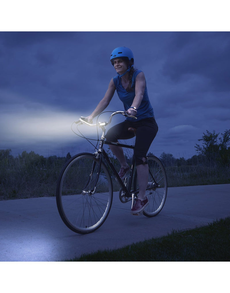 Girl using radiant® 50 bike light white LED at night