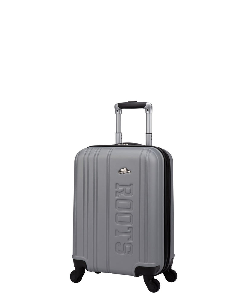 Roots Identity 19" Hardside Spinner Carry-on in silver with verticle grooves and embossed word Roots on front