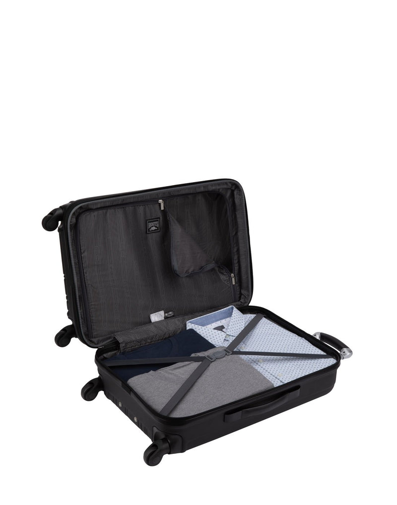 Roots Identity Hardside 28" Expandable Spinner open with clothes packed inside with tie down straps on one side and zippered partition on the other side