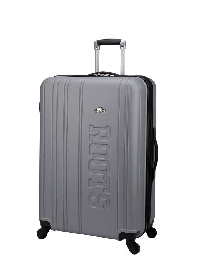 Roots Identity Hardside 28" Expandable Spinner in silver with verticle grooves and embossed word Roots on front