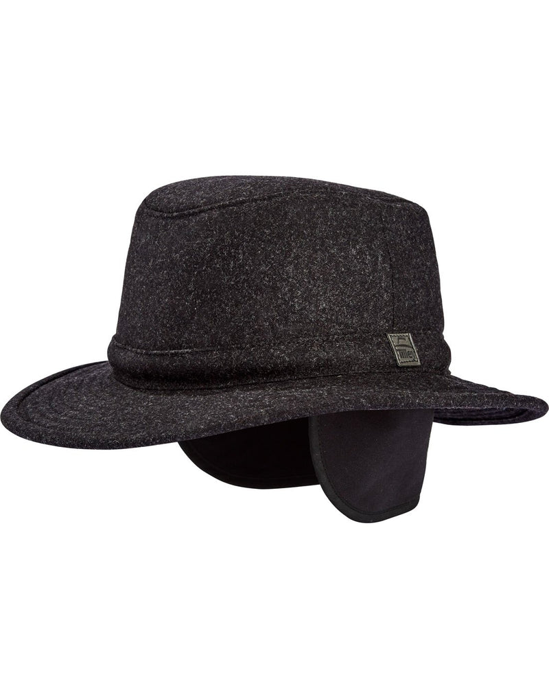 Tilley TTW2 Tec Wool Hat in black, front angled view with ear warmers pulled down from inside brim of hat