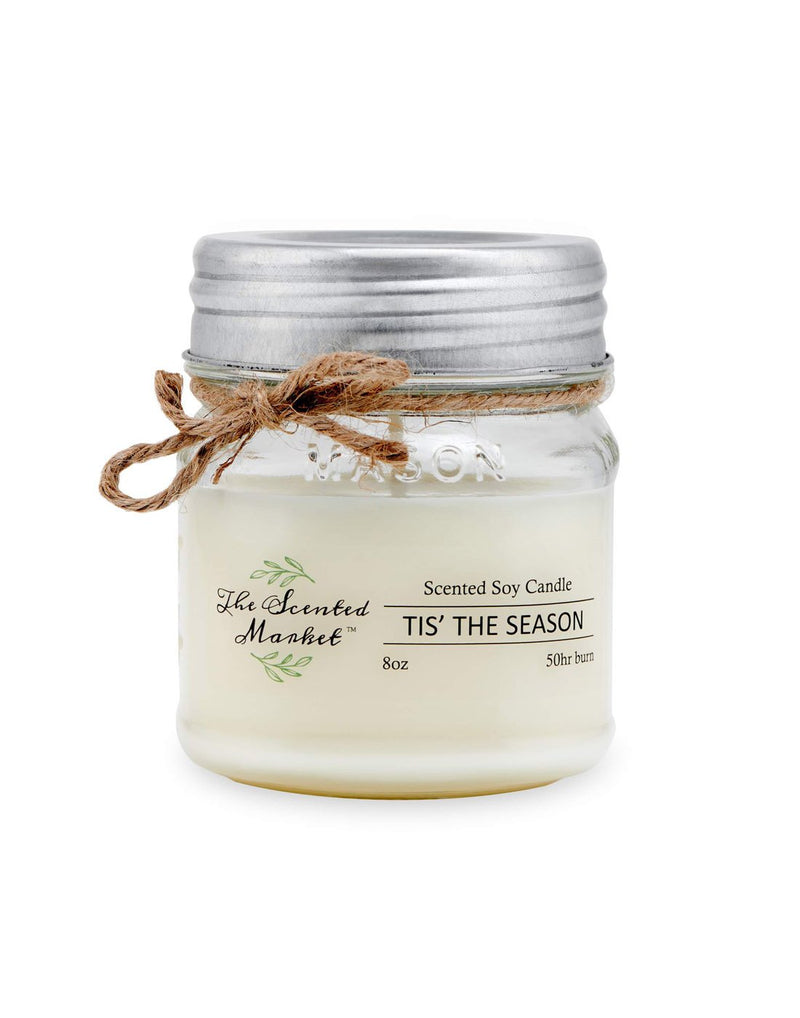 The Scented Market Tis' the Season 8oz Soy Wax Candle front view in a glass jar with metal lid and tied with a twine bow