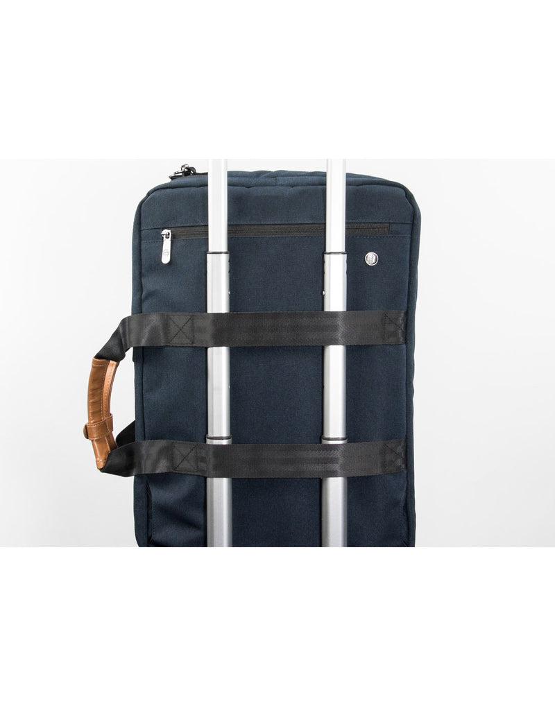 PKG Trenton II Backpack Overnighter - navy, back view showing trolley straps looped around a luggage handle