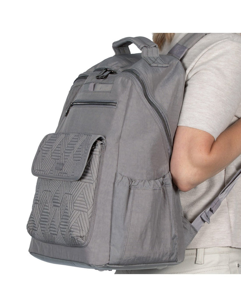 Women wearing lug tumbler backpack pearl grey colour side view