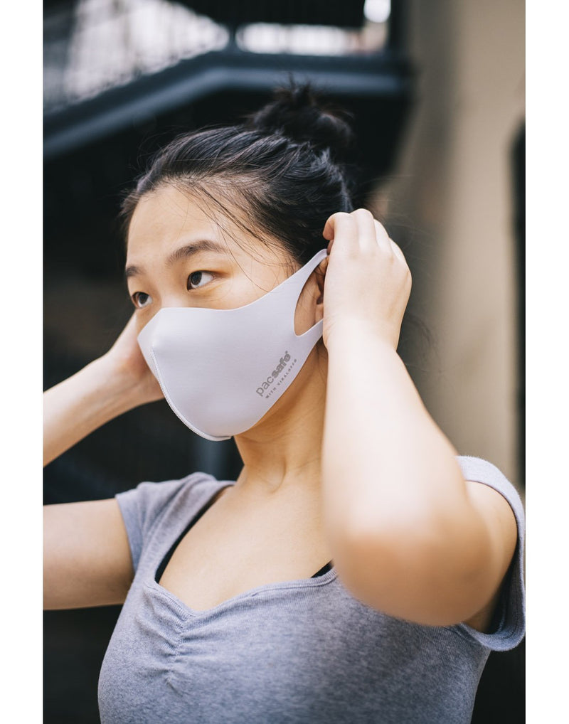 Girl wearing alo grey colour mask