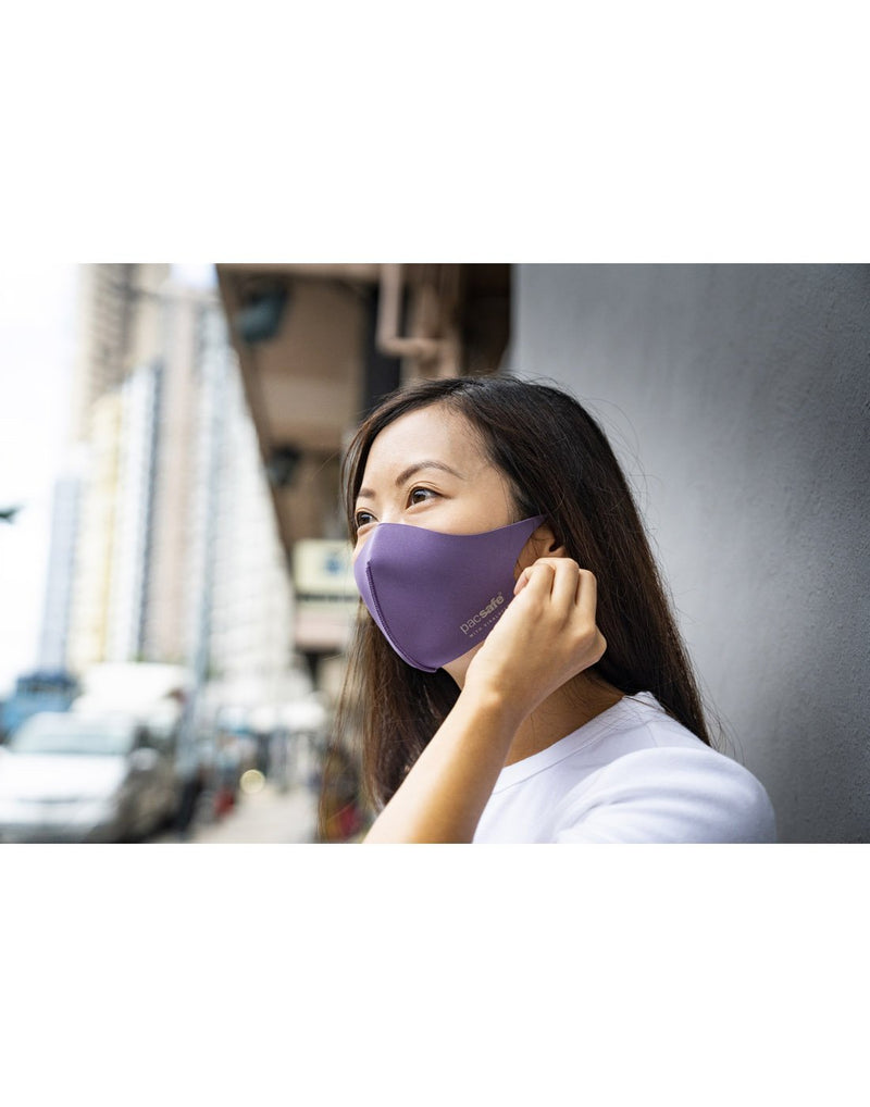 Girl wearing lilac colour mask