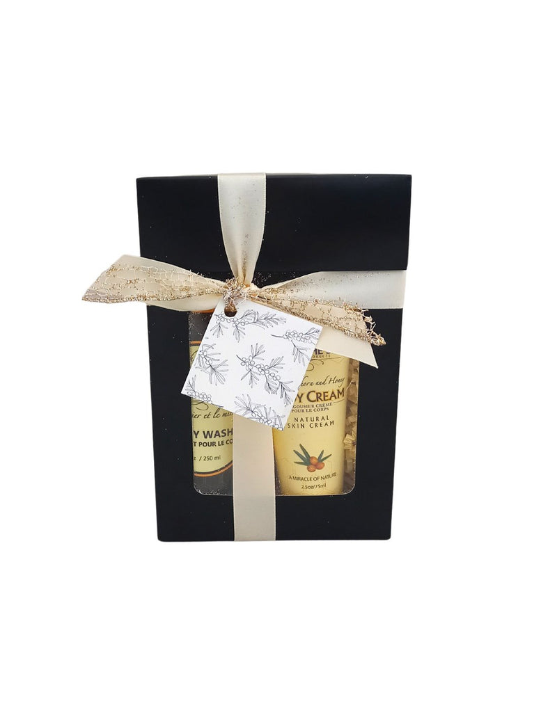 Bee by the Sea Winter Indulgence Gift Set box with clear window to see contents and silver and gold bow and tag