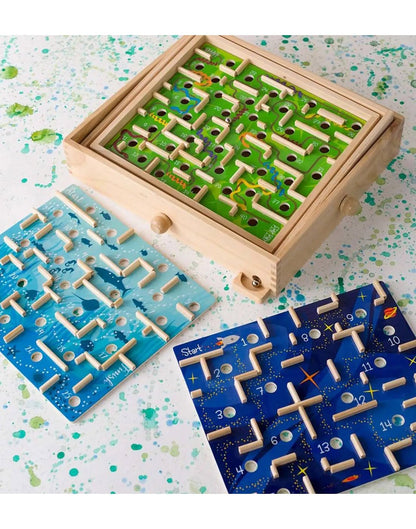 Close up of wooden labyrinth game with 3 maze boards